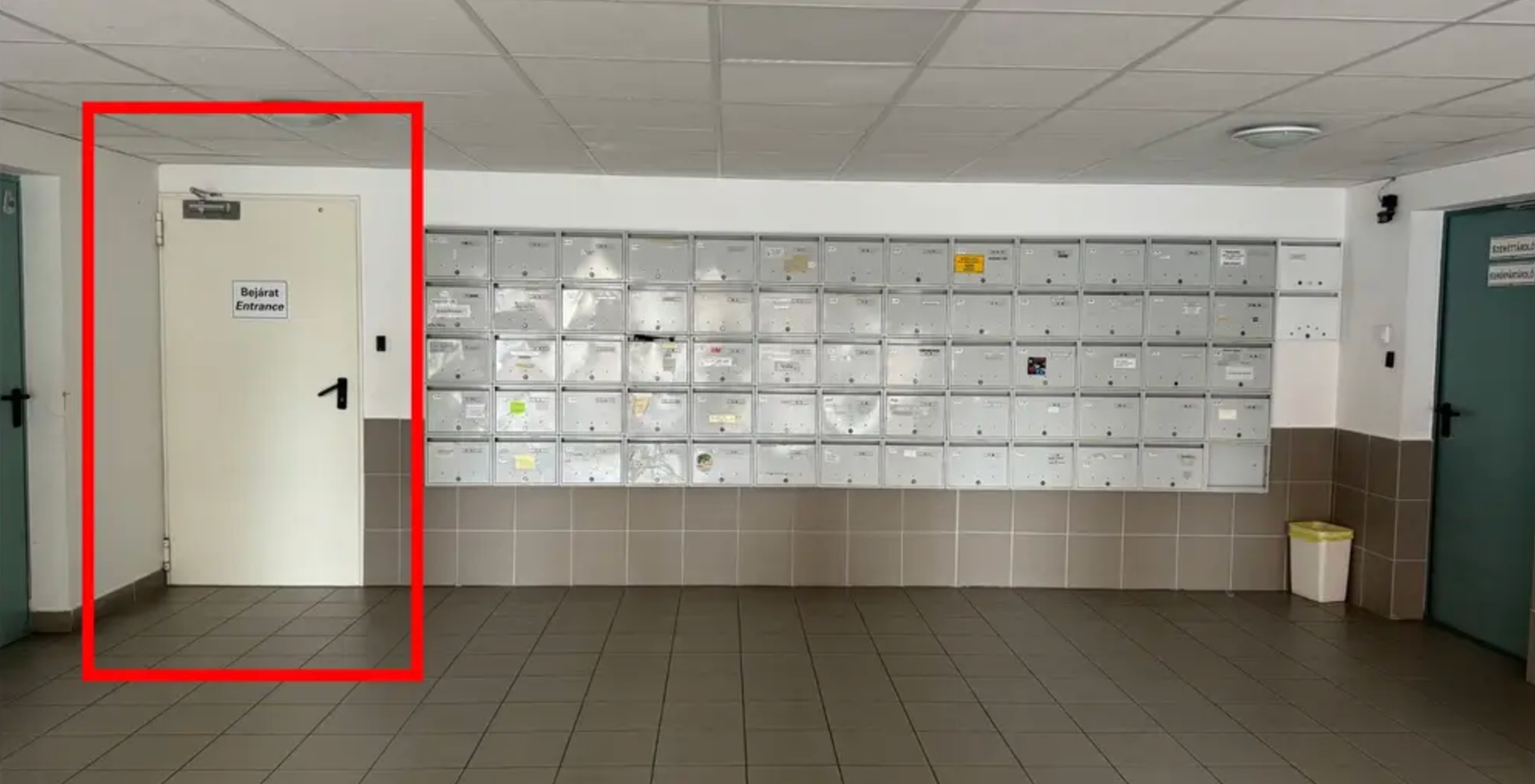 Door left from the postboxes